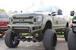 Sturdy off-road bumpers mounted on a lifted truck ready for adventure