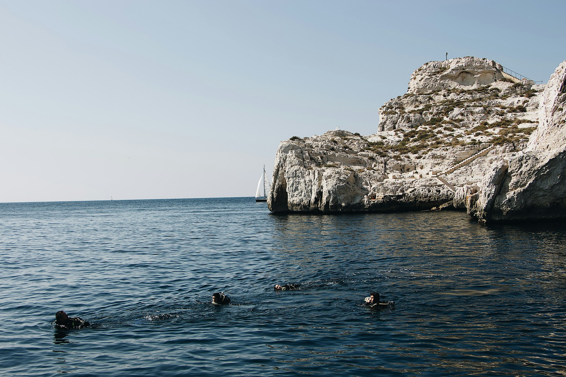 woman wearing yellow long-sleeved dress under white clouds and blue sky during daytime
