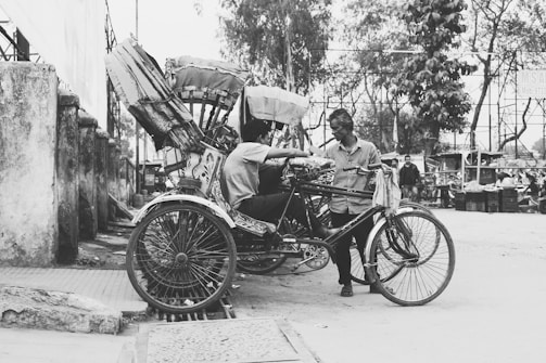 A group of rickshaw drivers sharing a moment of camaraderie during a community event organized by SMV Wheels.
