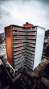 aerial photography of brown-and-white concrete high-rise building