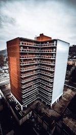 aerial photography of brown-and-white concrete high-rise building