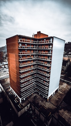 aerial photography of brown-and-white concrete high-rise building