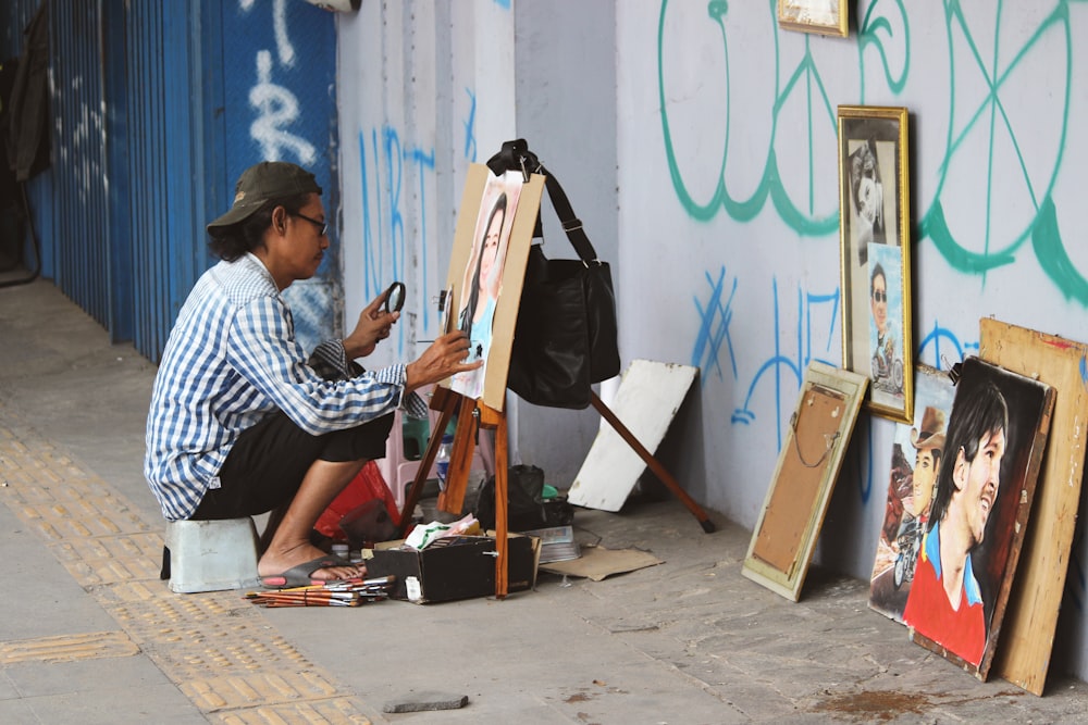 man painting woman