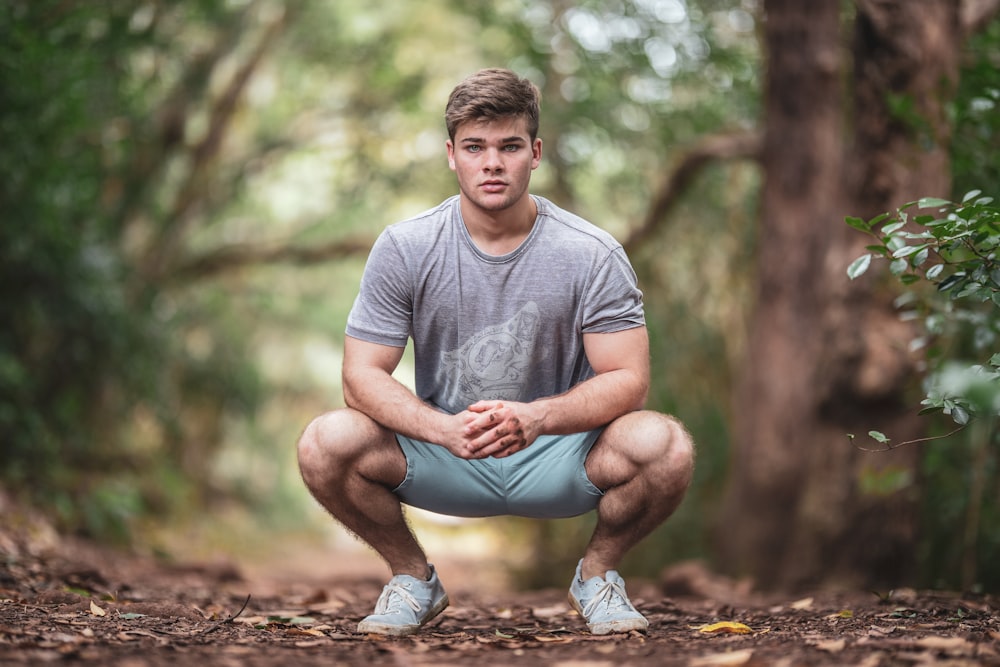 man wearing gray crew-neck t-shirt and shorts during daytime