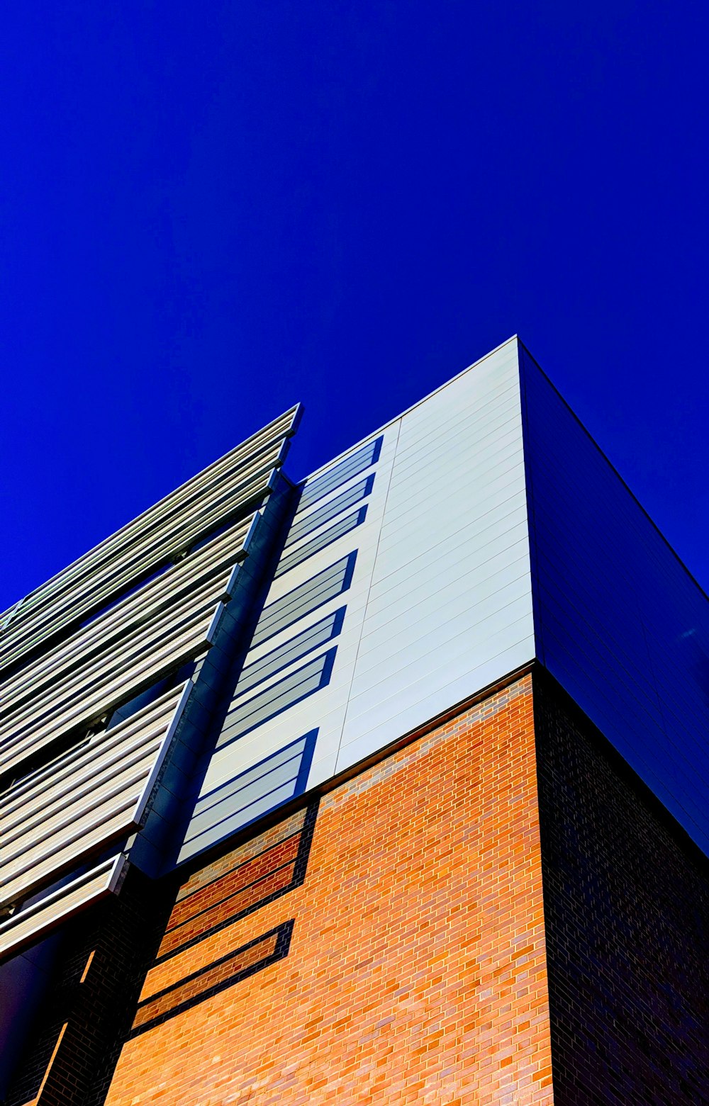 low-angle photography of brown and white buildin