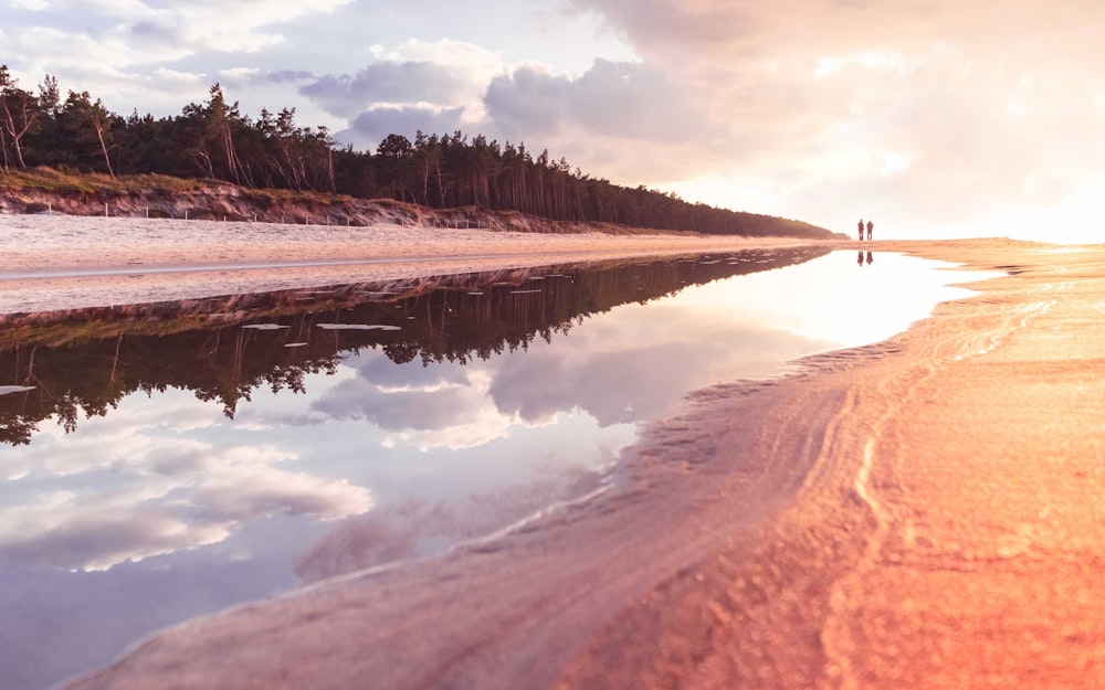 body of water during sunset