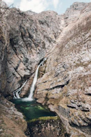 brown waterfalls surround of rocks