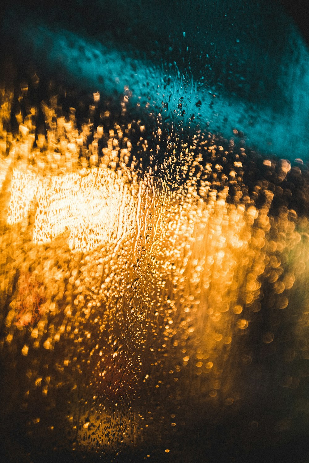 a close up of a rain covered window