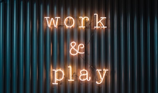 Work and Play yellow neon sign