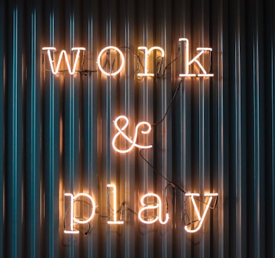 Work and Play yellow neon sign