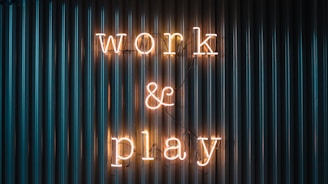 Work and Play yellow neon sign