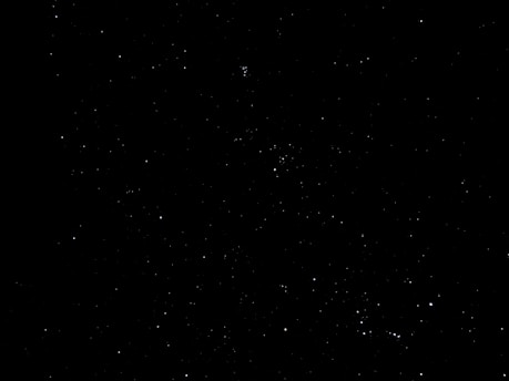 A mysterious night sky filled with unidentified flying objects.