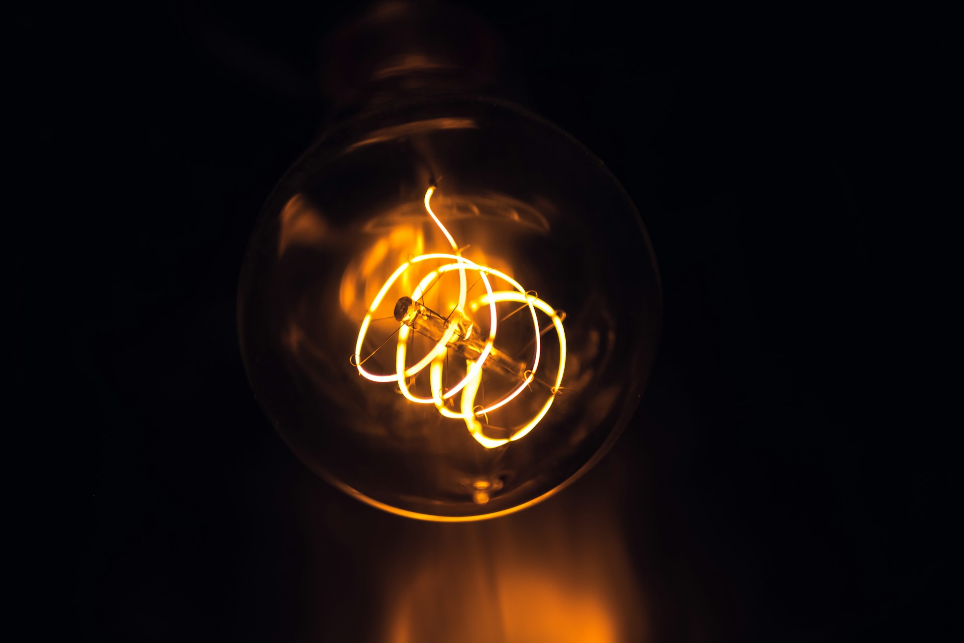 a light bulb is glowing in the dark