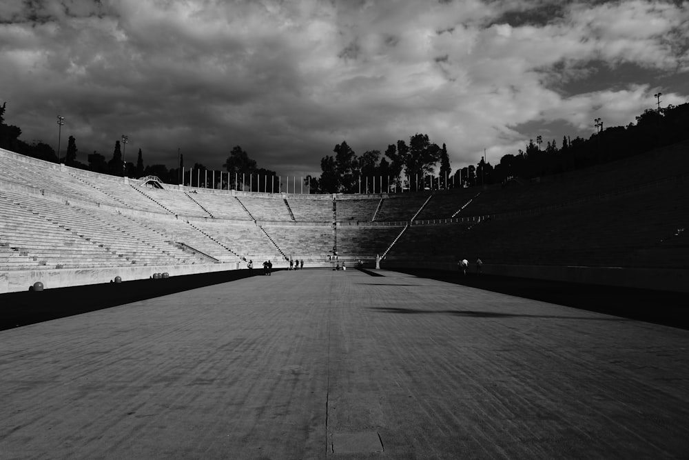 grayscale photography of open stadium