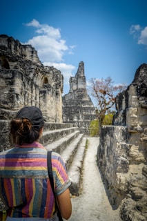 person standing on black and gray landmark