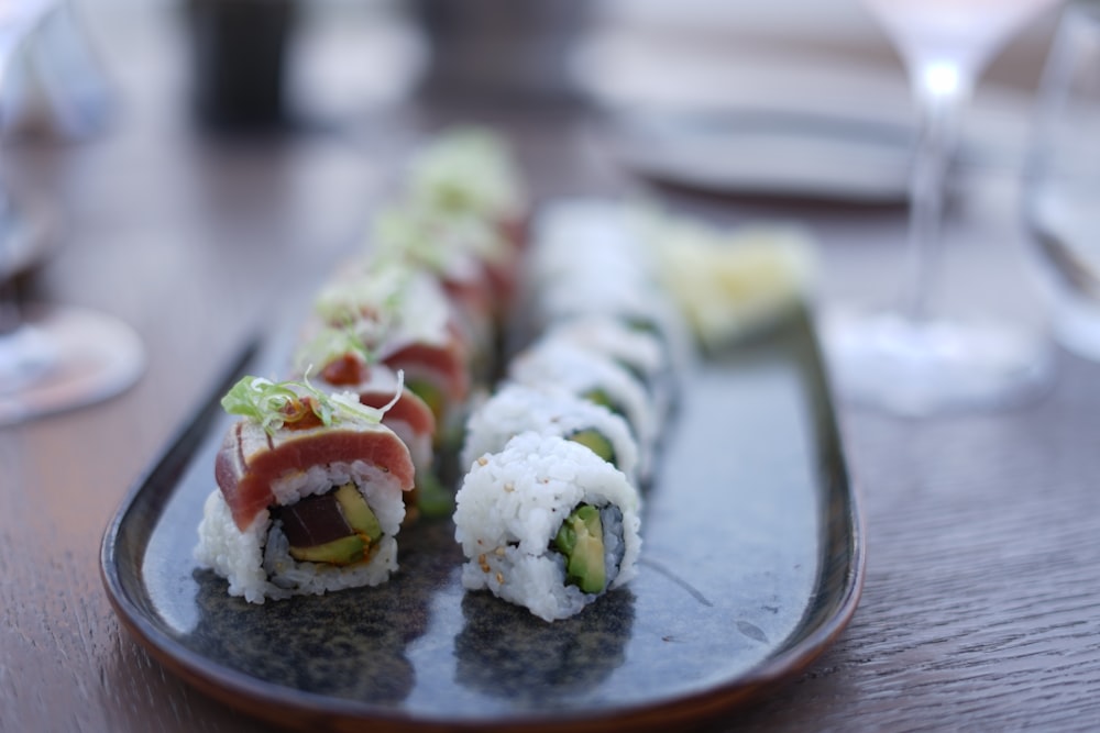 sushi plates on gray platter