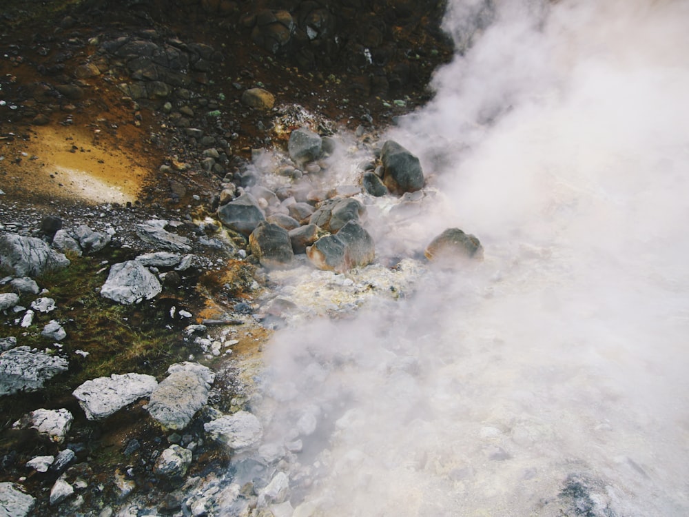 a hot spring in the middle of a rocky area