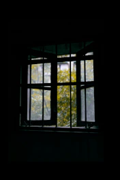 A room with windows open, showing fresh air flowing to reduce cannabis smoke odors.