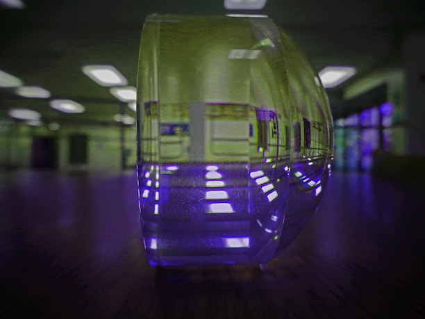 Close-up of a modern plexiglass wall decoration shining under soft indoor lighting.