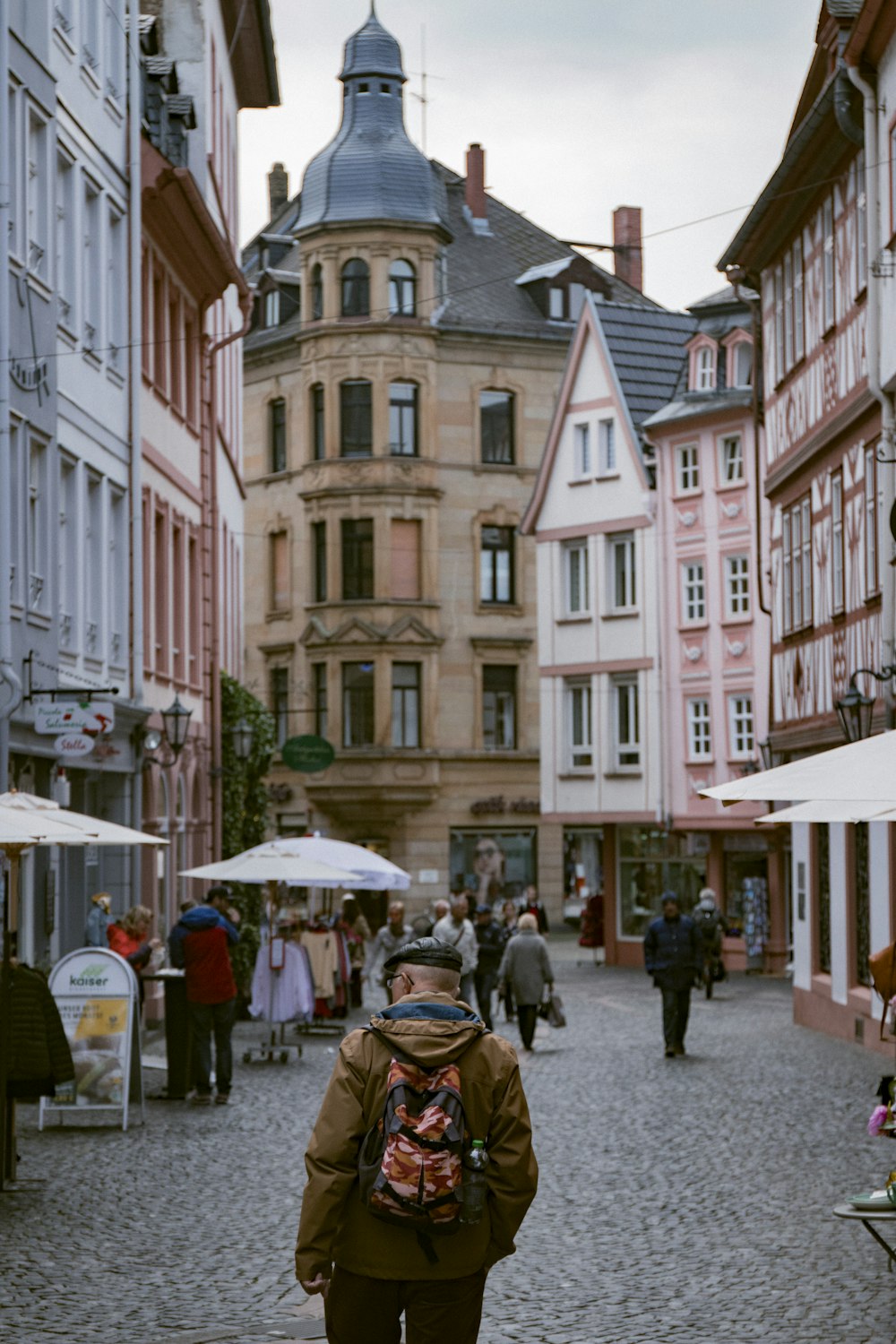 people walking between buildings