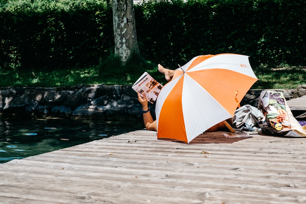 person lying on dock