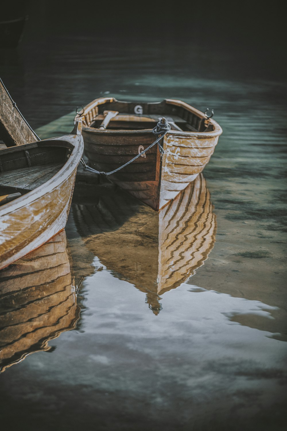 a couple of boats that are sitting in the water