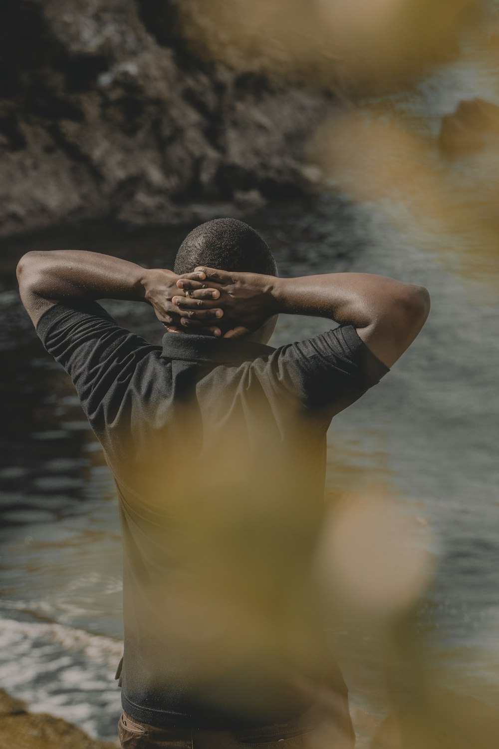 man standing near body of water