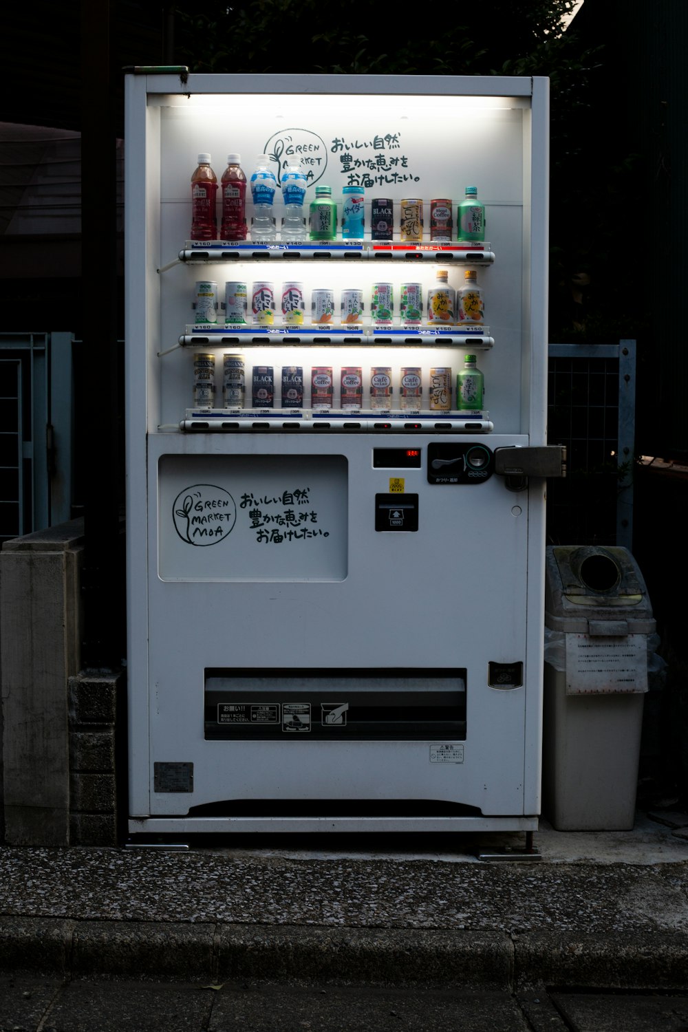 white vending machine with lights turned on