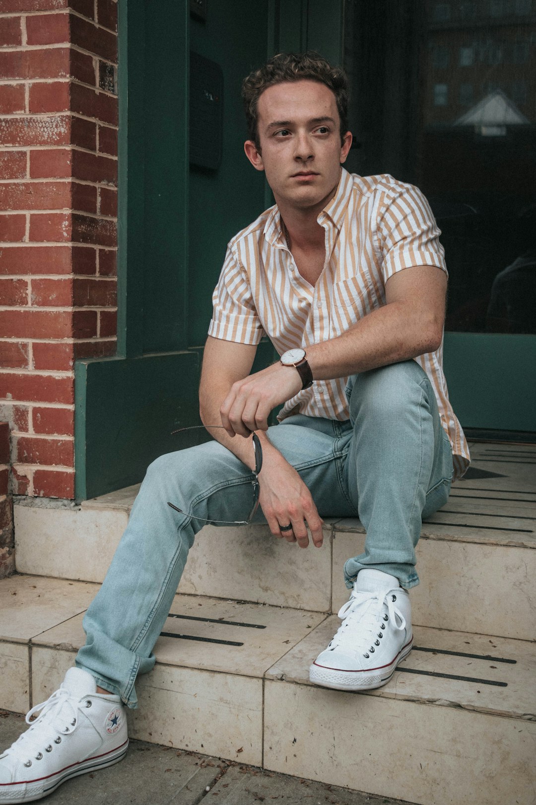 man sitting on stairs