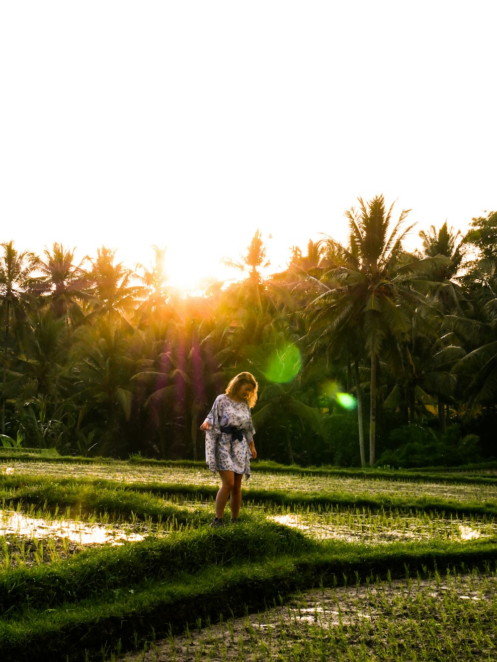 woman standing on grass during daytime