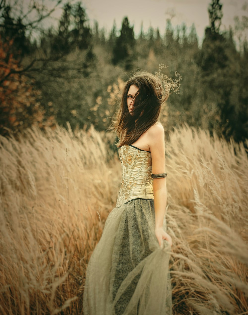 woman in green dress near field