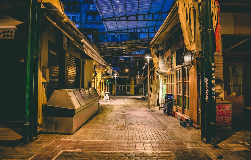 a narrow alley way with a skylight above it