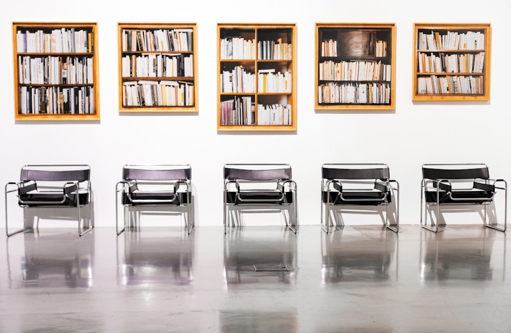 five brown bookcases