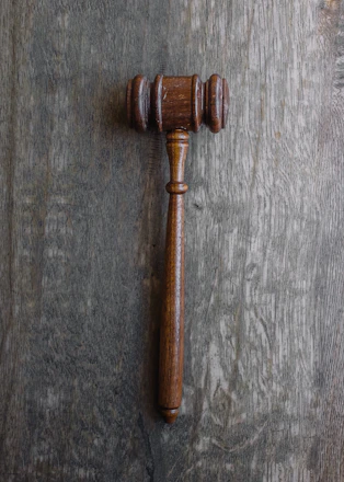 A close-up of legal documents and a gavel.