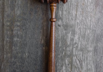 brown mallet on gray wooden surface