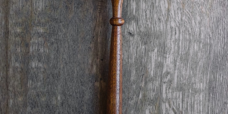 brown mallet on gray wooden surface