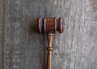 brown mallet on gray wooden surface