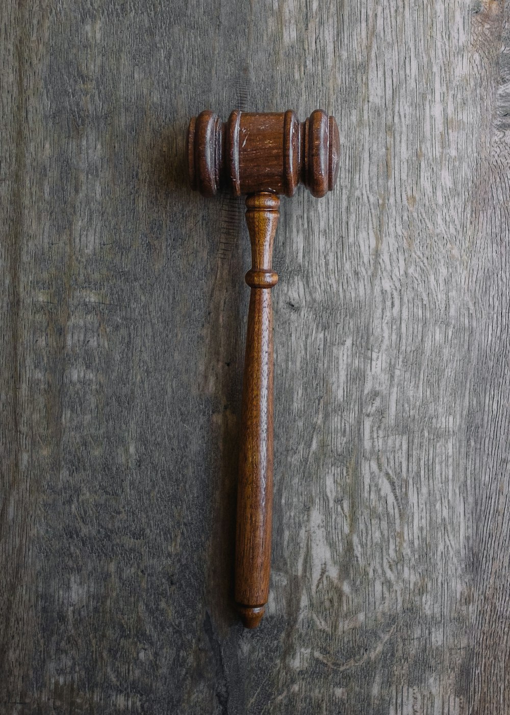 brown mallet on gray wooden surface