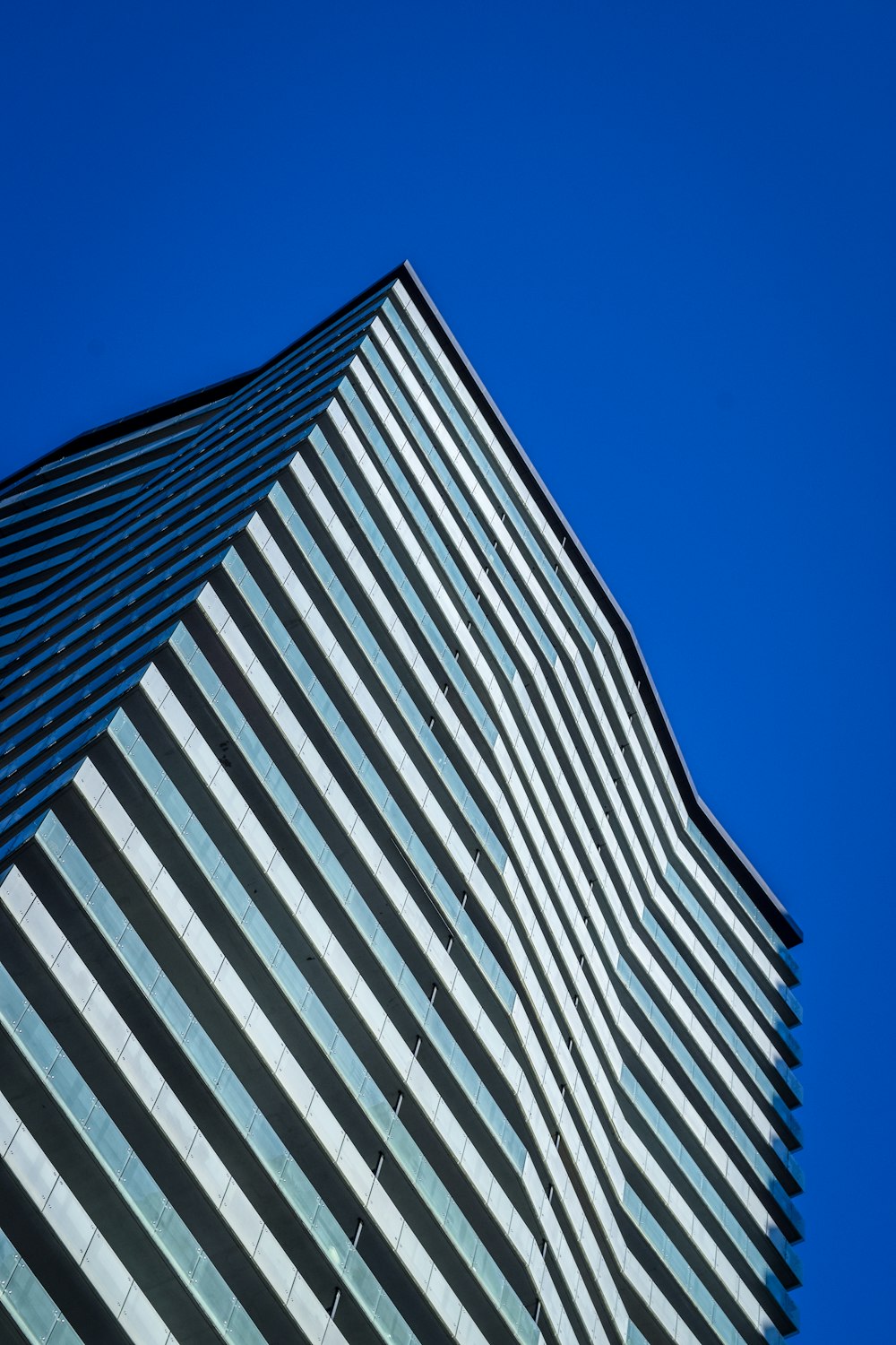 low angle photography of building under blue sky