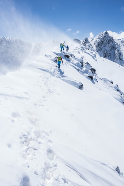 People skiing on snow ground