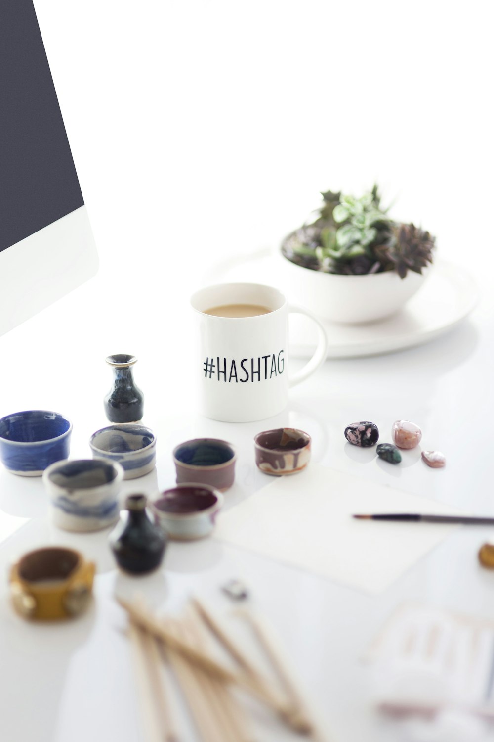 white #hashtag ceramic mug filled with coffee