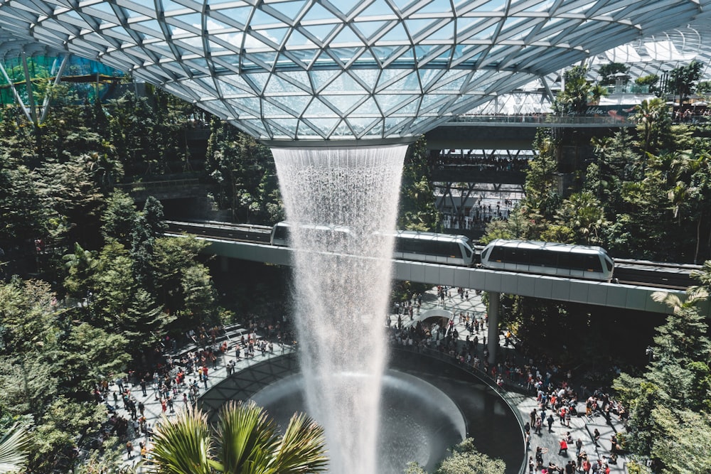 time-lapse photography of water pouring from a glass ceiling