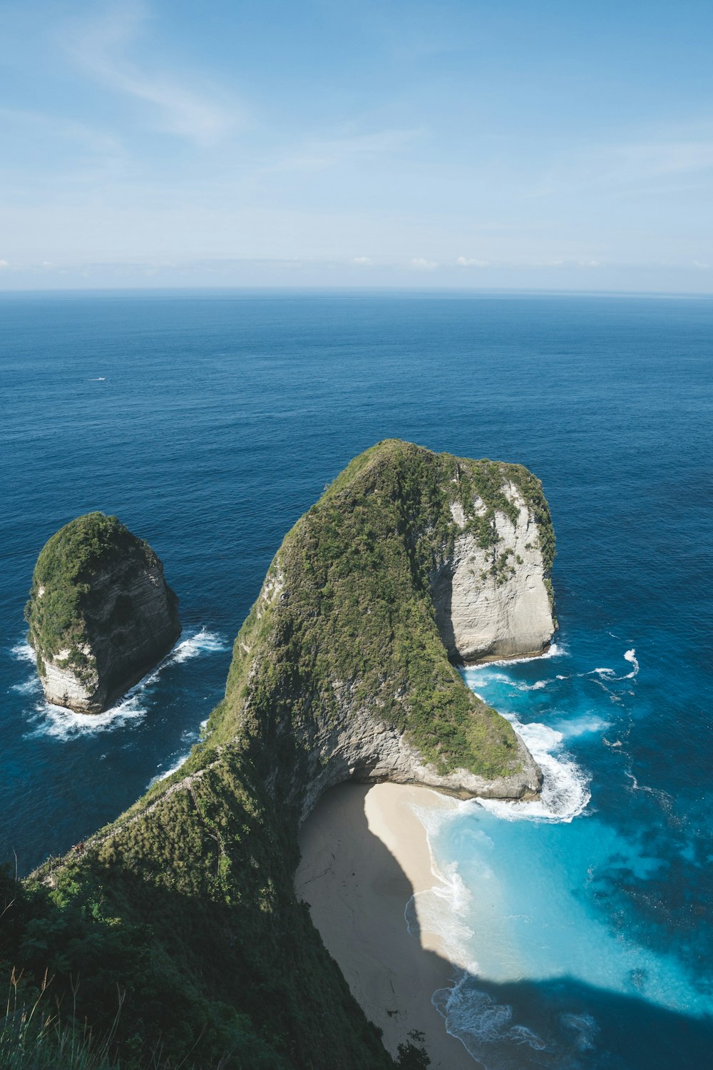 aerial photography of rock formation near sea