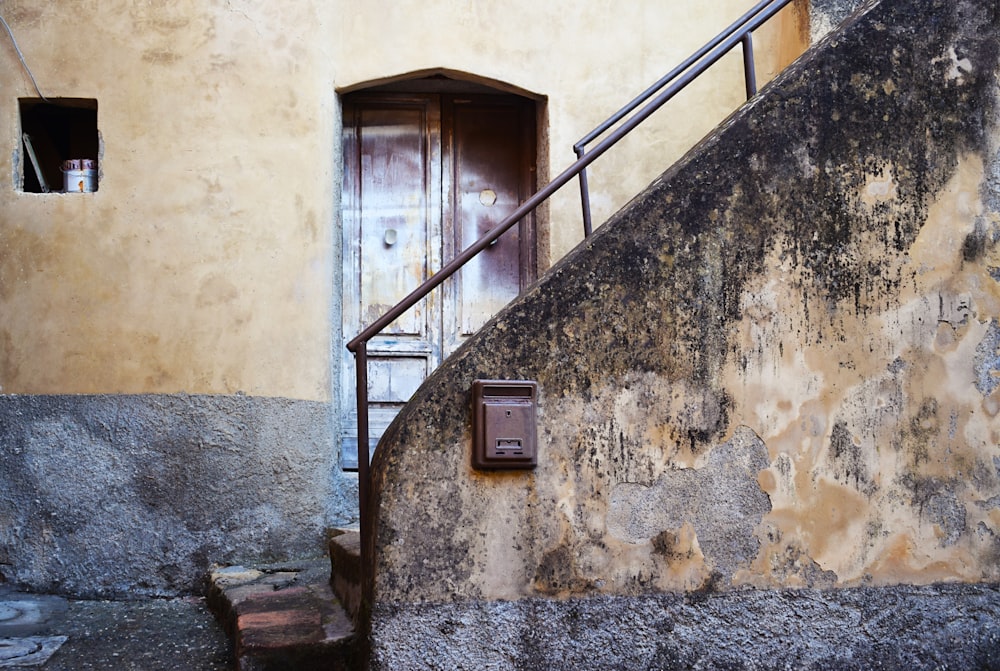 brown and black stair beside door