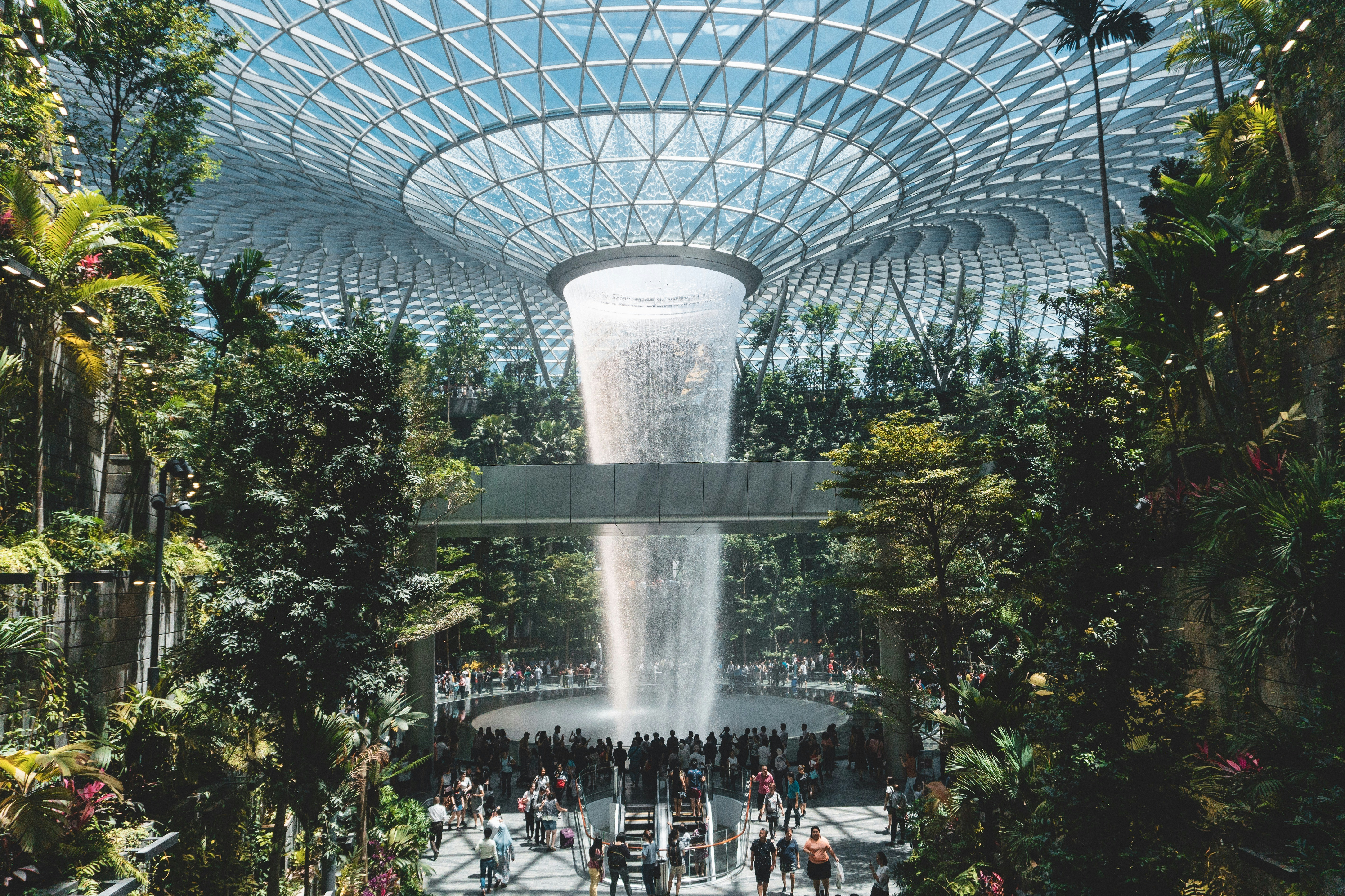 people standing beside gray concrete structure during daytime, 