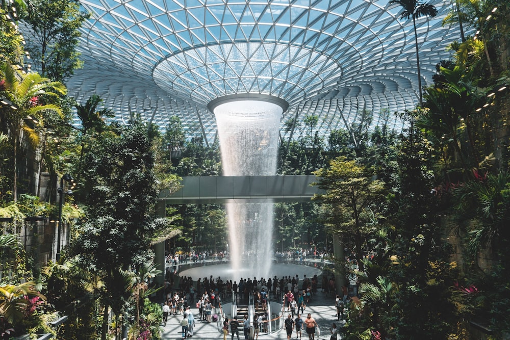 people standing beside gray concrete structure during daytime