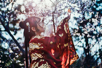 An artistic depiction of Manmatha wielding his sugarcane bow under a blooming spring tree.