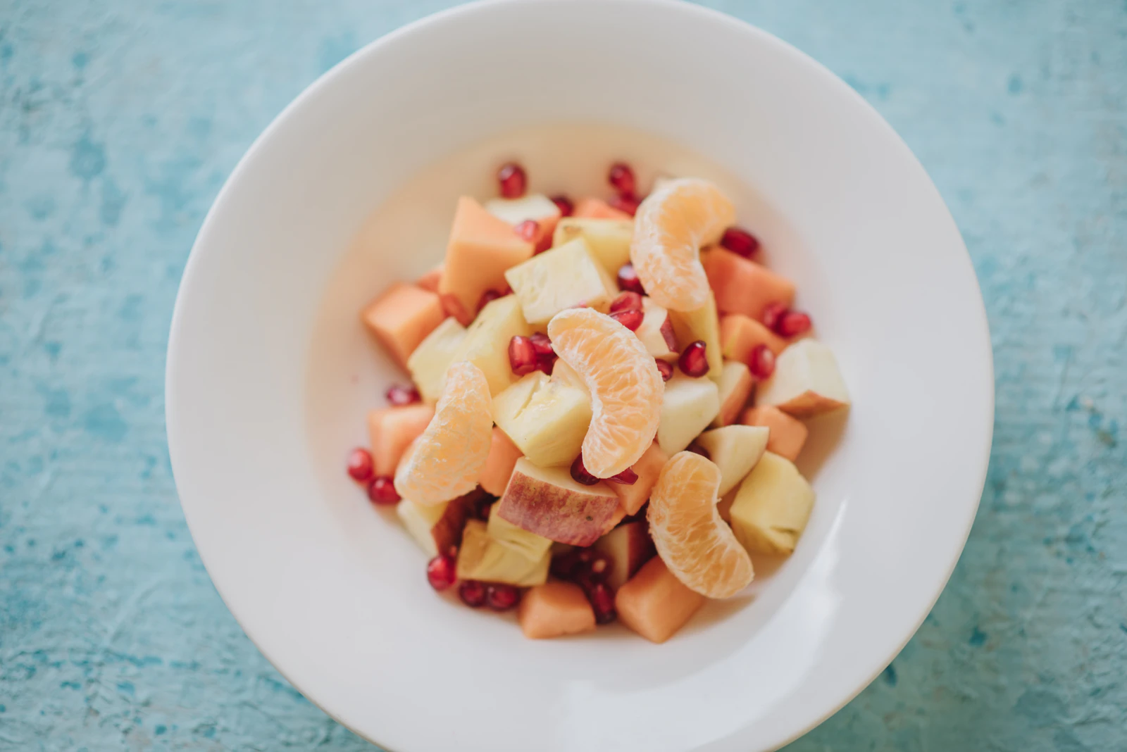 Fresh fruit salad served in a bowl.