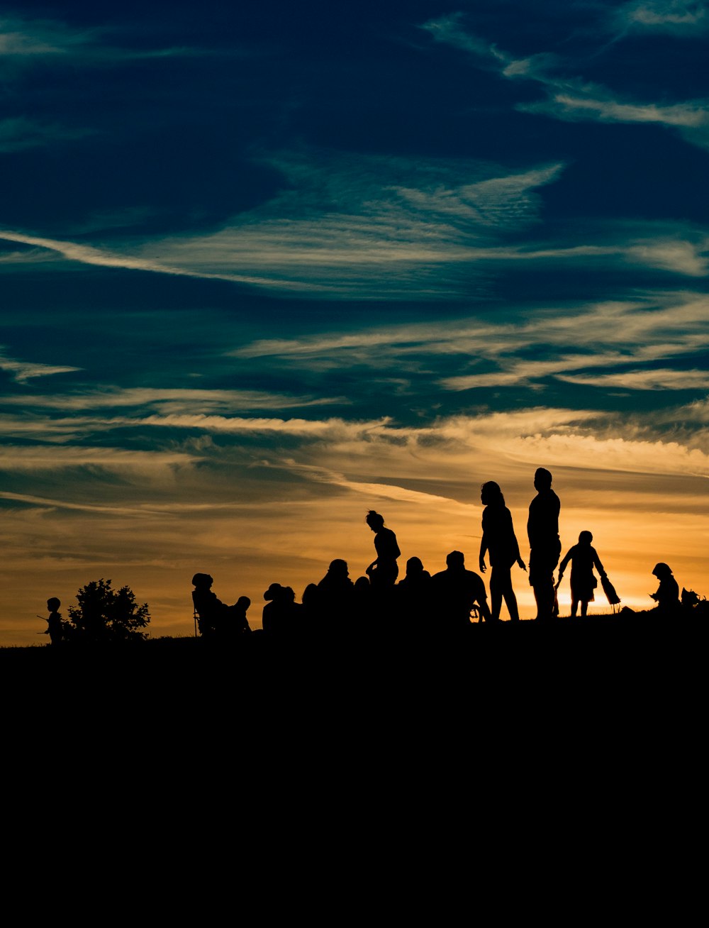 silhouette of people during golden hour