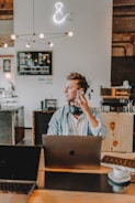 one unknown person holding smartphone wearing blue shirt